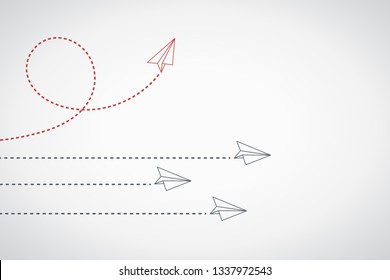 Think differently concept. Red airplane changing direction. New idea, change, trend, courage, creative solution, innovation and unique way concept.