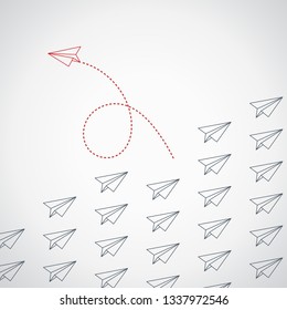 Think differently concept. Red airplane changing direction. New idea, change, trend, courage, creative solution, innovation and unique way concept.
