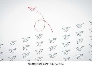 Think differently concept. Red airplane changing direction. New idea, change, trend, courage, creative solution, innovation and unique way concept.