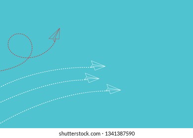 Think differently concept. Red airplane changing direction. New idea, change, trend, courage, creative solution, innovation and unique way concept.