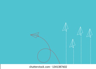 Think differently concept. Red airplane changing direction. New idea, change, trend, courage, creative solution, innovation and unique way concept.