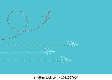 Think differently concept. Red airplane changing direction. New idea, change, trend, courage, creative solution, innovation and unique way concept.