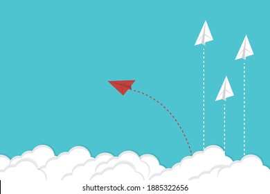 Think differently. Red airplane changing direction. New idea, change, trend, courage, creative solution, innovation and unique way concept.