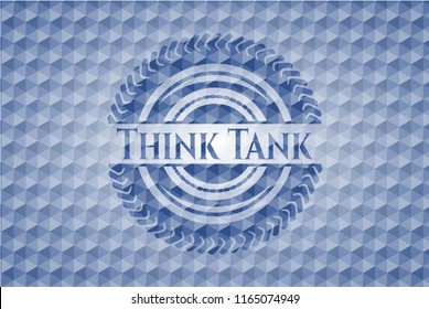 Think Tank blue emblem with geometric pattern background.