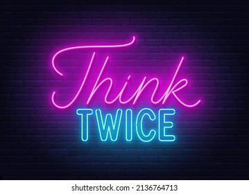 Think Twice neon lettering on brick wall background.