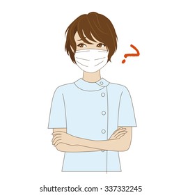 A thinking female young dental assistant with surgical mask