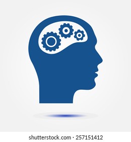 Thinking icon.  Silhouette of gear in head 
