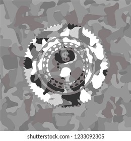thinking in money icon inside grey camouflaged emblem