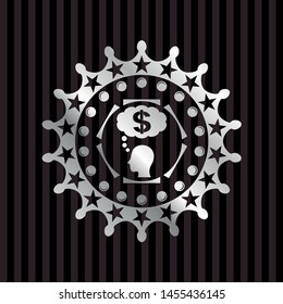 thinking in money icon inside silver emblem