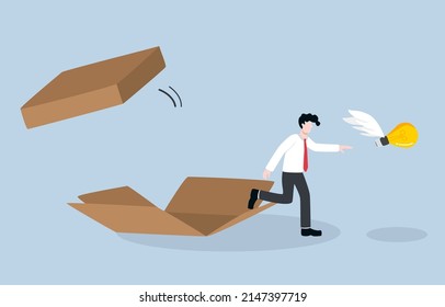 Thinking outside box to develop career path, business advancement, creative or innovative idea concept. Brave businessman coming out of box to chase light bulb idea. 