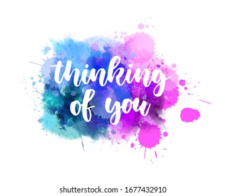 Thinking of you - handwritten modern calligraphy inspirational text on multicolored watercolor paint splash. Blue and purple colored background with abstract dots decoration. Love concept.