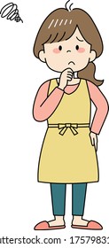 Thinking young woman in yellow apron
