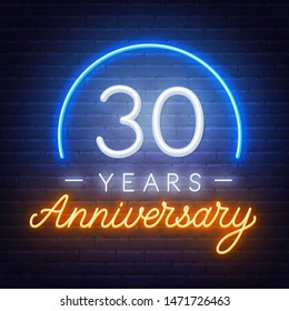 Thirty years anniversary celebration neon sign on a dark background. Template for invitation or greeting card.