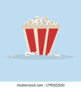 This is a cup of popcorn on blue background.
