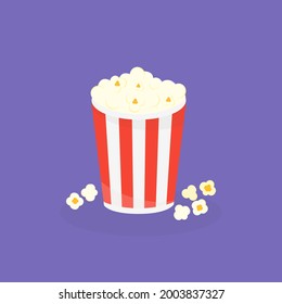 This is a cup of popcorn on purple background.