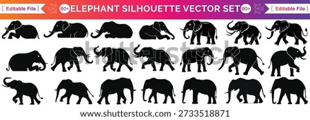This elephant shows a happy elephant with its trunk up high. The elephant is lifting its trunk in the air like it's celebrating. You can see the elephant's big body and large ears clearly