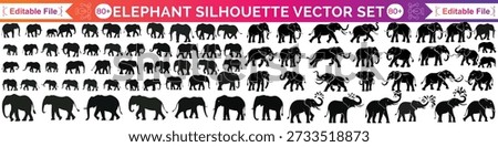 This elephant shows a happy elephant with its trunk up high. The elephant is lifting its trunk in the air like it's celebrating. You can see the elephant's big body and large ears clearly