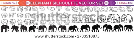 This elephant shows a happy elephant with its trunk up high. The elephant is lifting its trunk in the air like it's celebrating. You can see the elephant's big body and large ears clearly