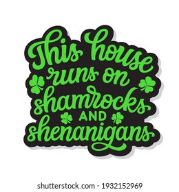 This house runs on shamrocks and shenanigans. Hand lettering quote with clover isolated on white background. Vector typography for St. Patrick's day decor, t shirts, posters, cards, banners