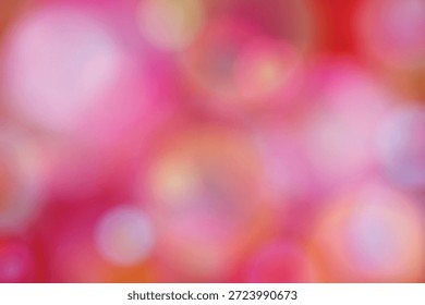 Dieses Bild zeigt einen schönen Bokeh-Effekt mit einer weichen Mischung aus rosa und orangefarbenen Tönen. Der Hintergrund ist unscharf, was eine verträumte und künstlerische Atmosphäre schafft. Die Bokeh-Lichter sind über das gesamte Bild verstreut, was Tiefe und Lebendigkeit erhöht.