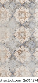 This image features a close-up view of a tile, showcasing its surface and texture. The focus highlights the details and patterns of the tile. It is positioned on the ground.
