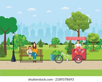 This image is for a park. An ice-cream shop keeper with an ice-cream van standing beside a road of a park. A little girl and a woman sitting in the park. The natural beauty of a park is shown here.