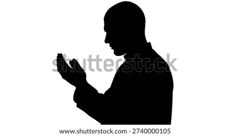 This image showcases a bold, black silhouette of a man in profile, with hands raised; its stark silhouette style is particularly distinctive.