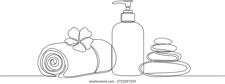 Esta Imagen muestra un ambiente sereno de spa con una toalla enrollada adornada con una flor, una botella de loción o jabón y una pila de piedras suaves, que evocan una sensación de tranquilidad y relajación.