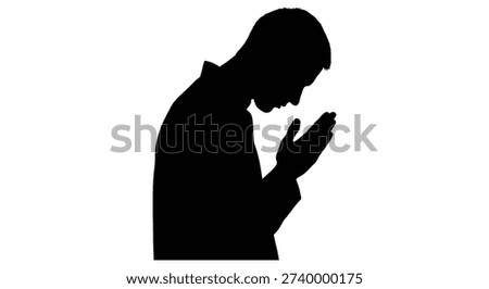 This image showcases a striking black silhouette of a man, characterized by its bold, flat style, appearing to pray or meditate.