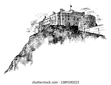 This image shows the castle. This fort is built on the mountain. There is Flag on the pinnacle of the Fort, vintage line drawing or engraving illustration.