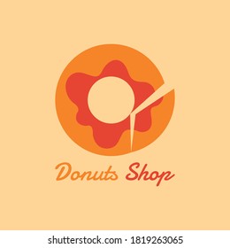 This is a logo design for a donut shop. Where there are slices / pieces on one side of the donut like a shop shape.