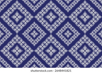 This pattern features ornate white floral elements arranged in layered diamond frames on a deep blue background, blending elegance with traditional Thai-inspired symmetry.