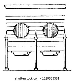 This is the representation showing two corner cast iron rack and a cast iron manger, vintage line drawing or engraving illustration.