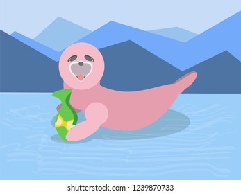 This is a seal with a gift on the ice lake near mountains. This gift is a fish from Santa Claus for Christmas and Happy New Year.
