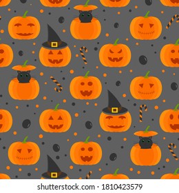 This is a seamless pattern with pumpkin, cat and hat on a gray background.