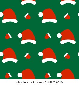 This is seamless pattern texture of Santa’s Claus hat and gloves on green background. Cartoon vector illustration. Wrapping paper.