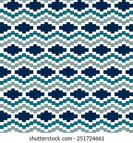  This vibrant ethnic geometric pattern combines zig-zag lines and diamond shapes in shades of blue, teal, and grey, creating a dynamic seamless vector background.