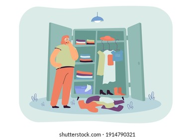 Thoughtful woman choosing clothes in wardrobe flat vector illustration. Cartoon lady standing in front of closet. Pile of dresses lying on floor. Fashion problems and dressing organization concept