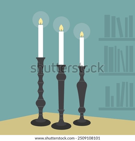 Three abstract cartoon style lit white candle sticks with black holders set on table with teal background