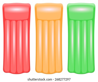 Three air mattresses in traffic light colors red, orange and green