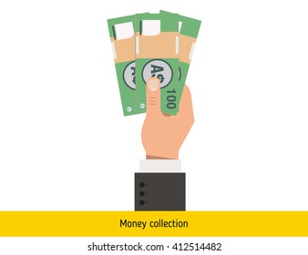 Drei australische Dollar in der Hand. Australische Dollar - Banknote.

