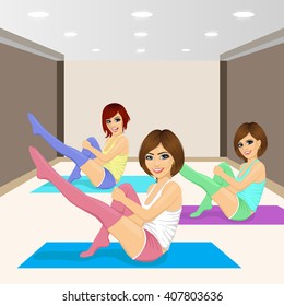 three beautiful girls doing aerobic workout on exercise mat in a gym club