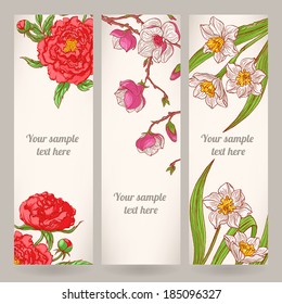 three beautiful vertical banners with different hand-drawn flowers 