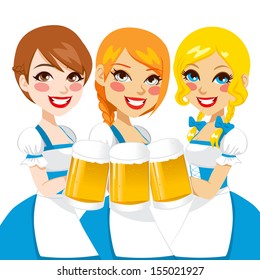 Three beautiful waitress holding beer mugs for Oktoberfest party toast dressed in a blue traditional dirndl 