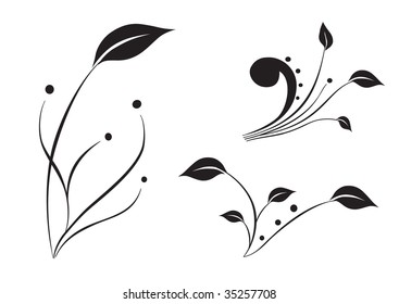 Three black silhouettes of plants isolated in white background