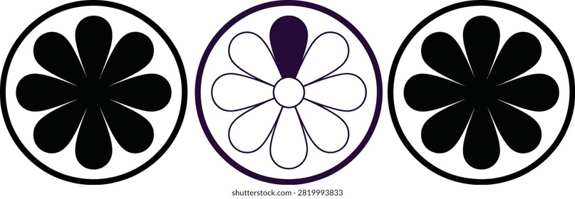 Three black and white car wheel hubcaps with floral design