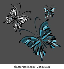 Three black-white-gray-blue butterflies on a gray background.