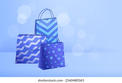 Three blue shopping bags with different patterns on a light blue background.