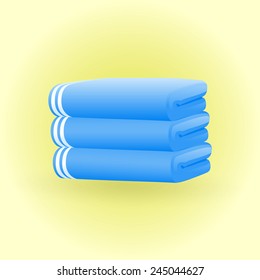 Three blue towels neatly stacked