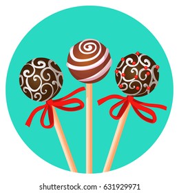 Three bonbones on stick with ornamental brown chocolate caramel